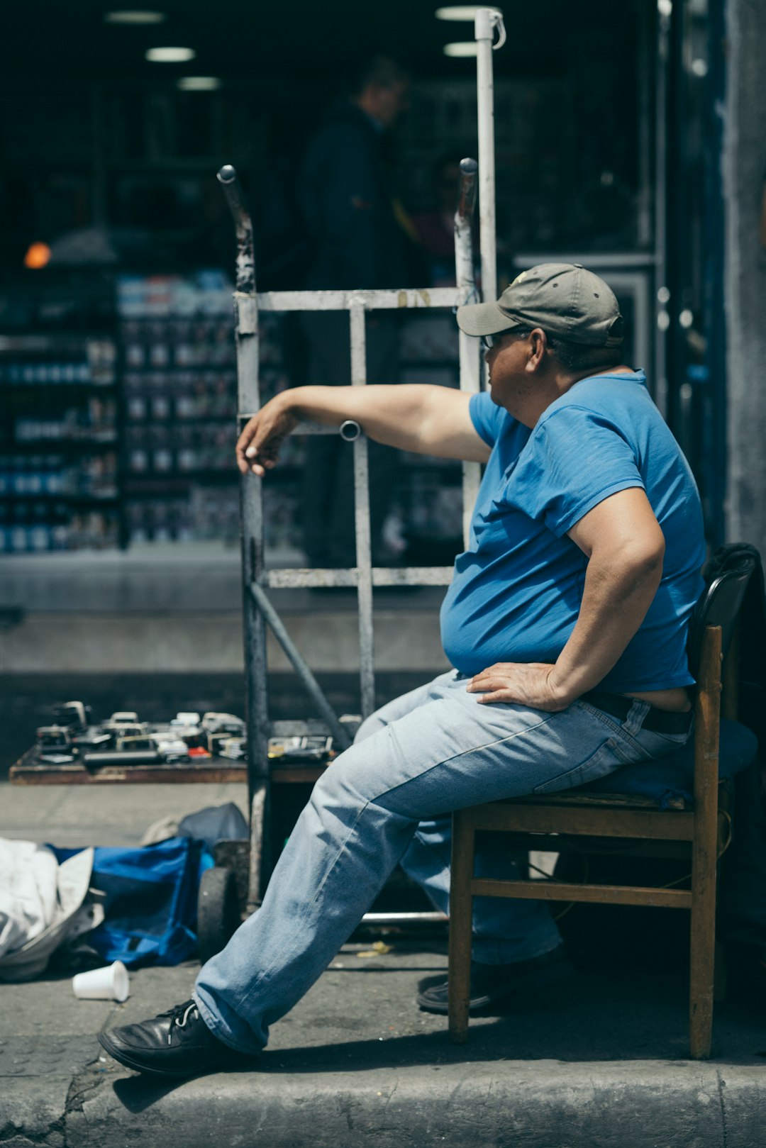 man sits on chair