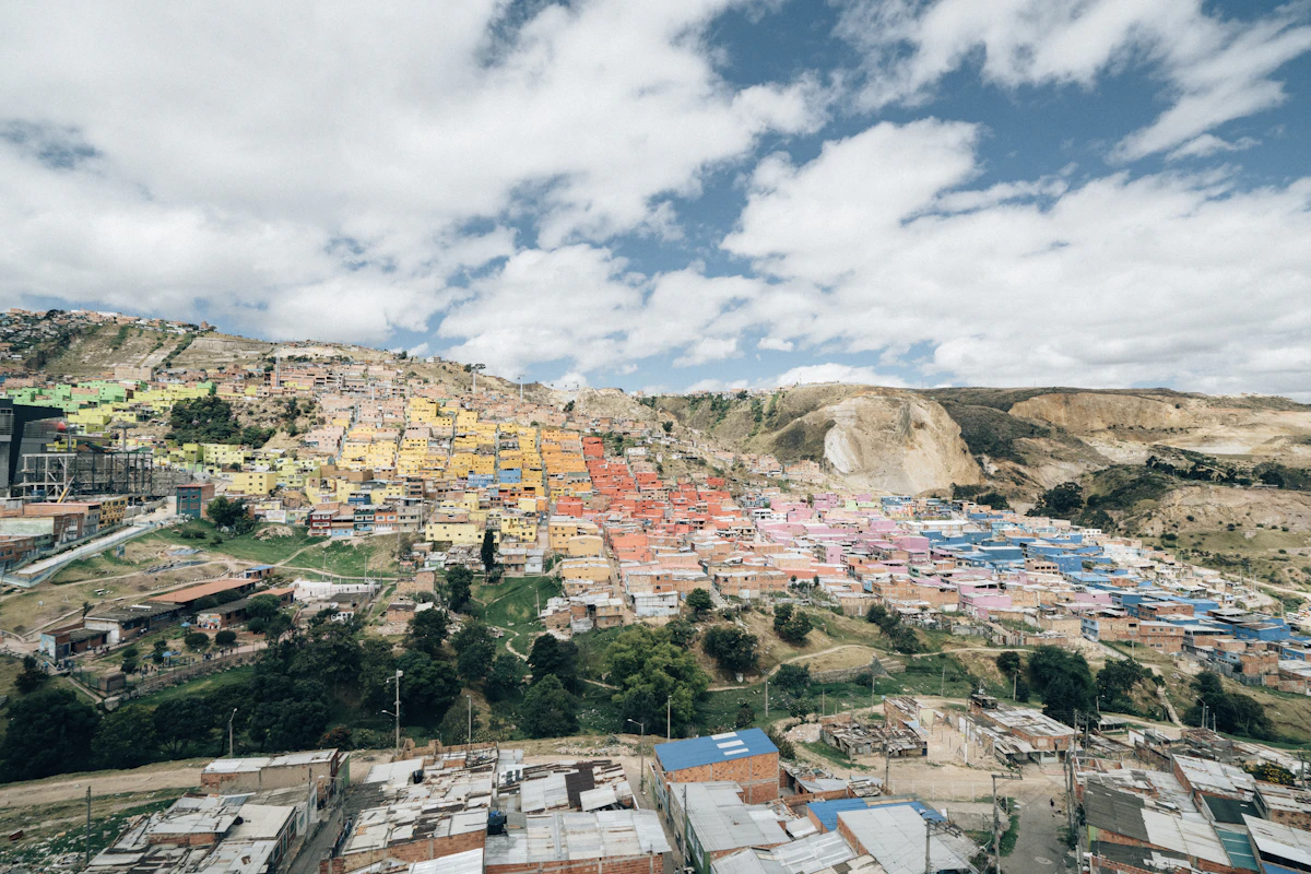 Bogotá's colourful hillside neighbourhoods and modern skyline seen from above