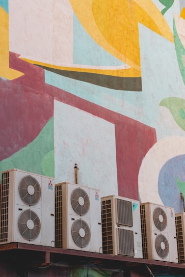pile of white outdoor AC units