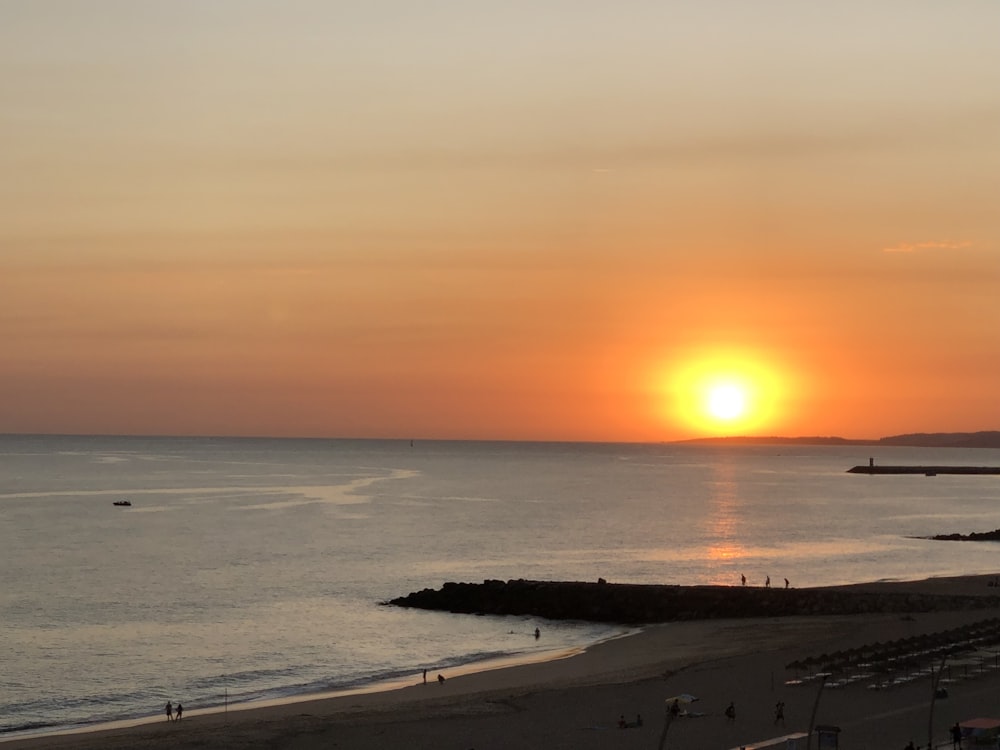 blue beach during sunset