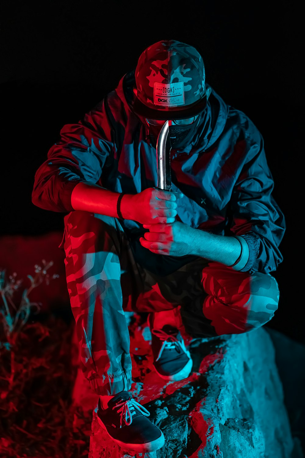 man sitting on rock