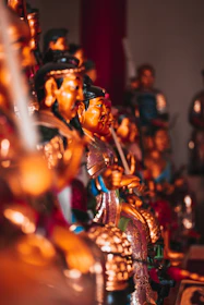 A vibrant arrangement of niche, limited-edition figures lit gently to highlight their craftsmanship.