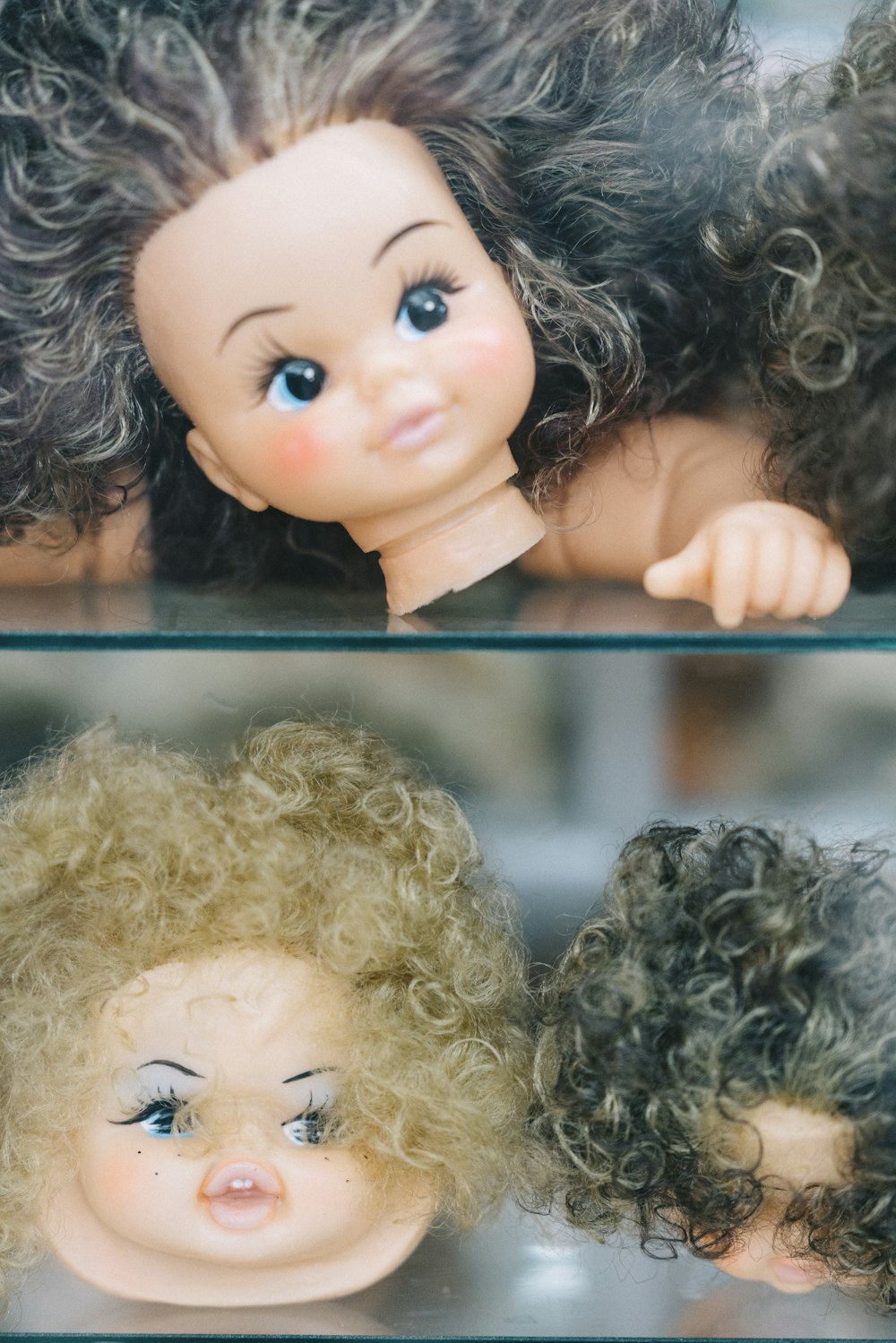 female doll heads collage