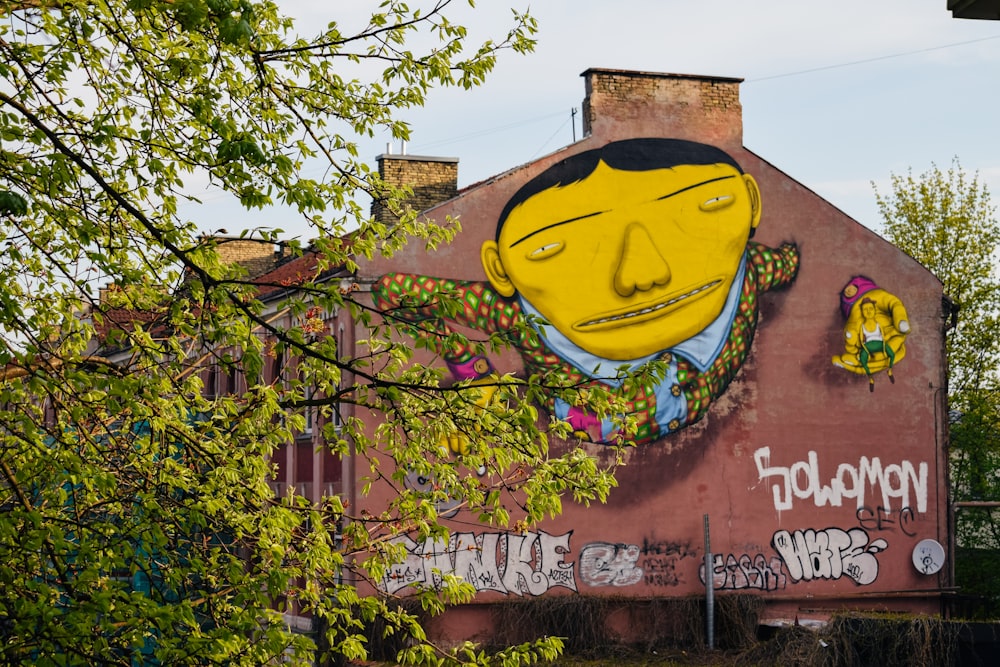 man wearing blue and green dress shirt graffiti