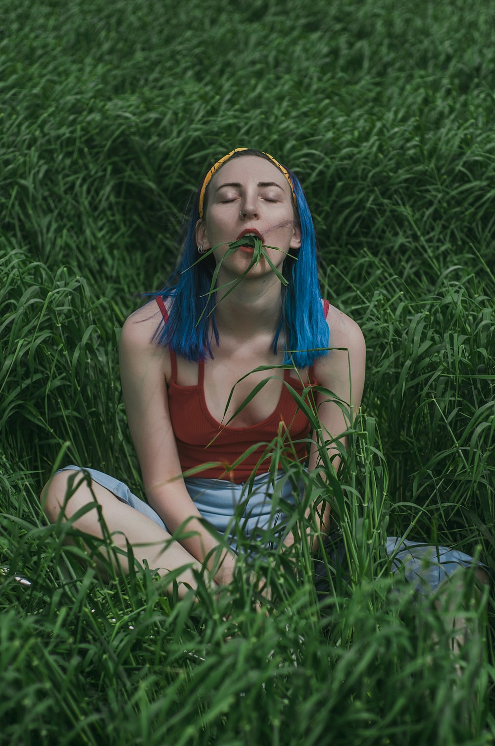 woman sits on grass