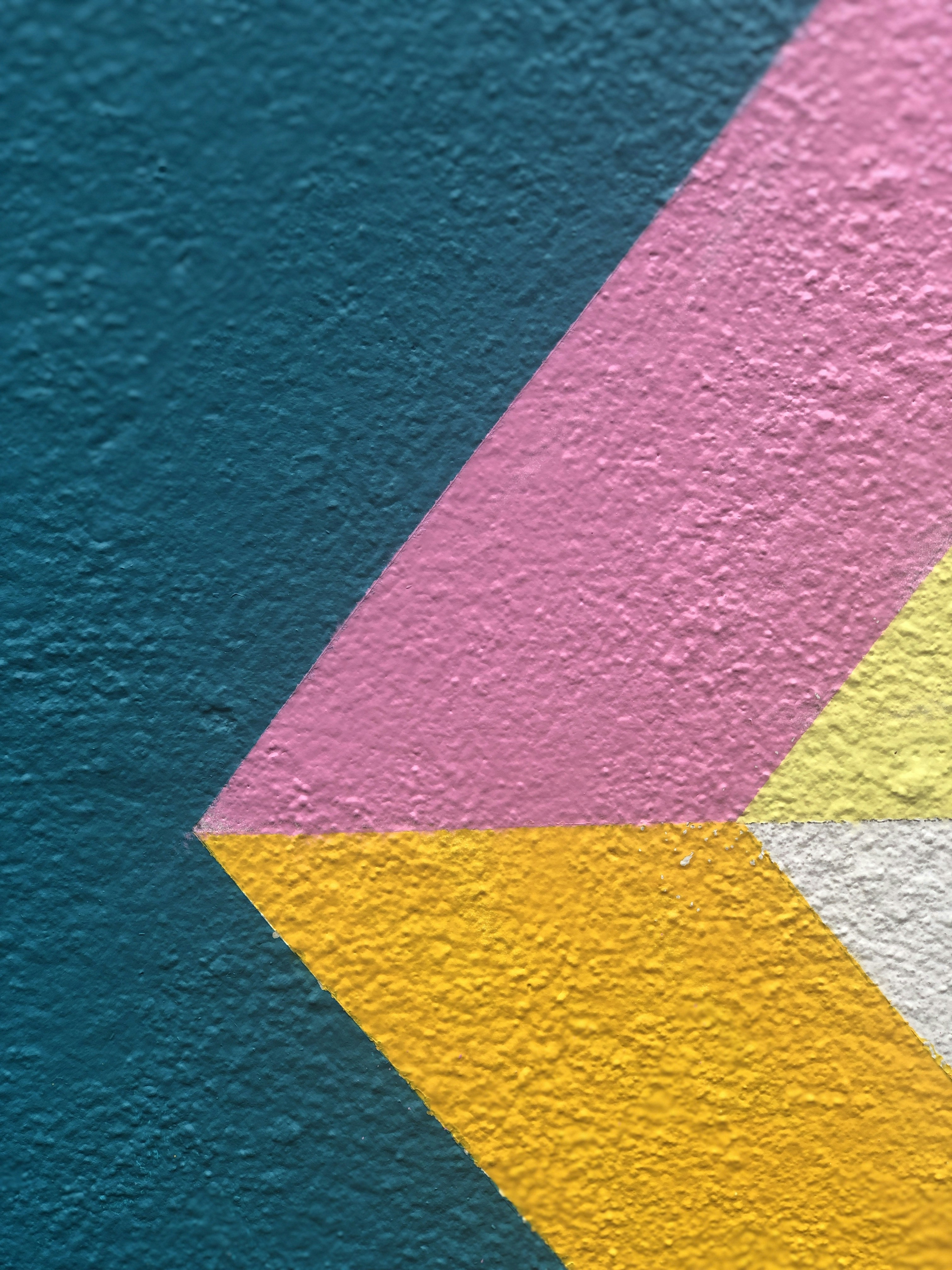 a close up of a wall with a colorful design on it