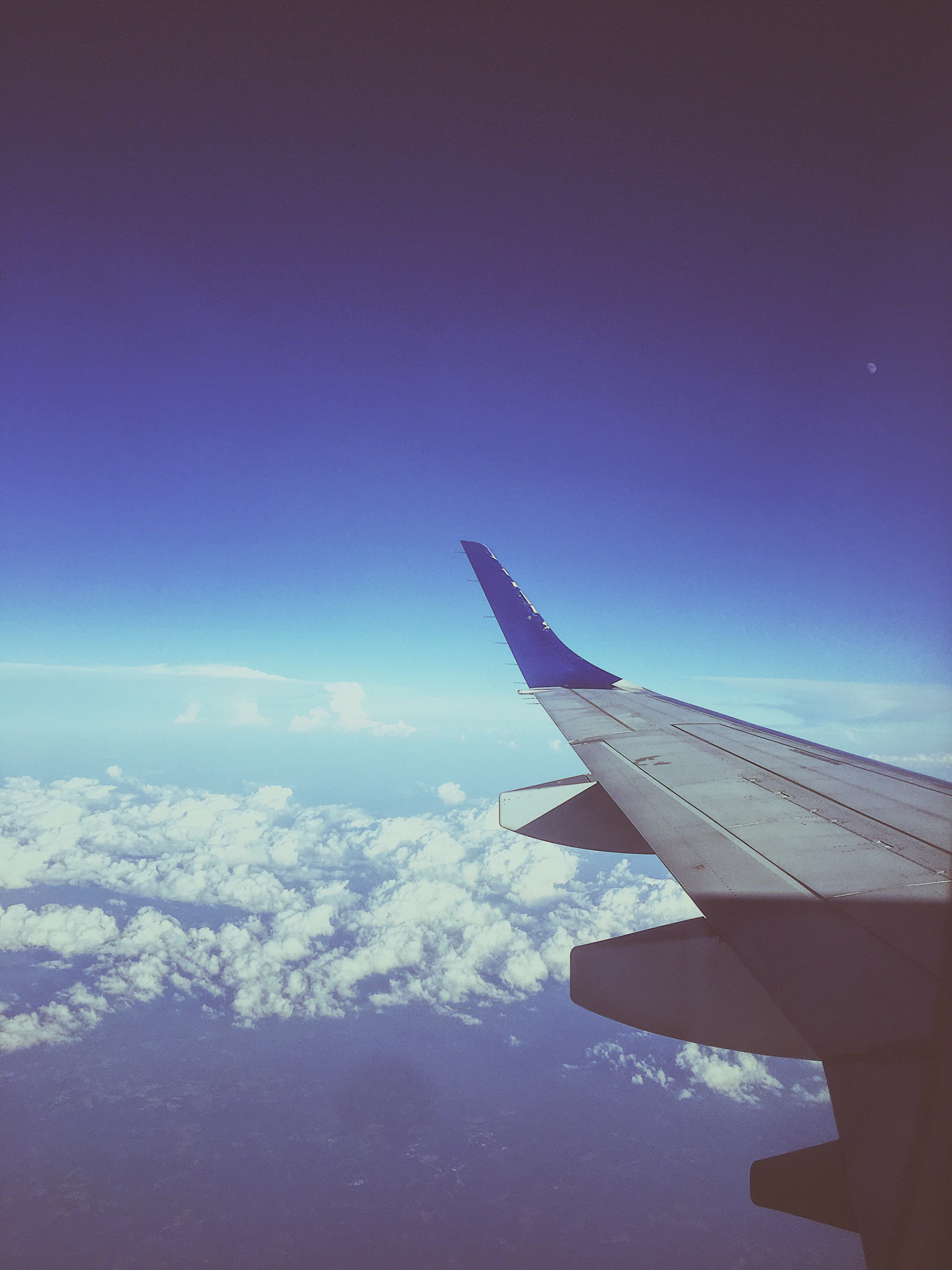 woman wearing yellow long-sleeved dress under white clouds and blue sky during daytime