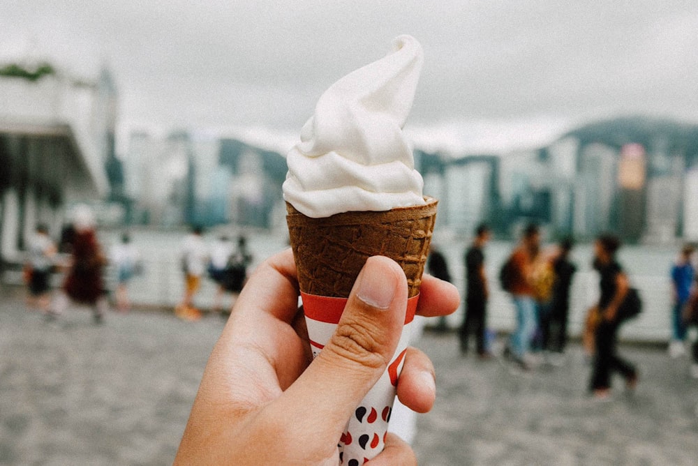 white ice cream on sugar cone