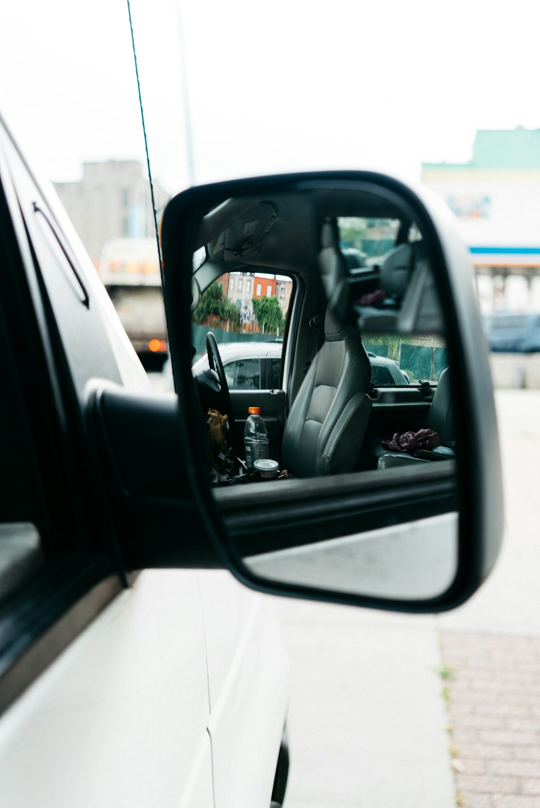 closeup photography of vehicle wing mirror