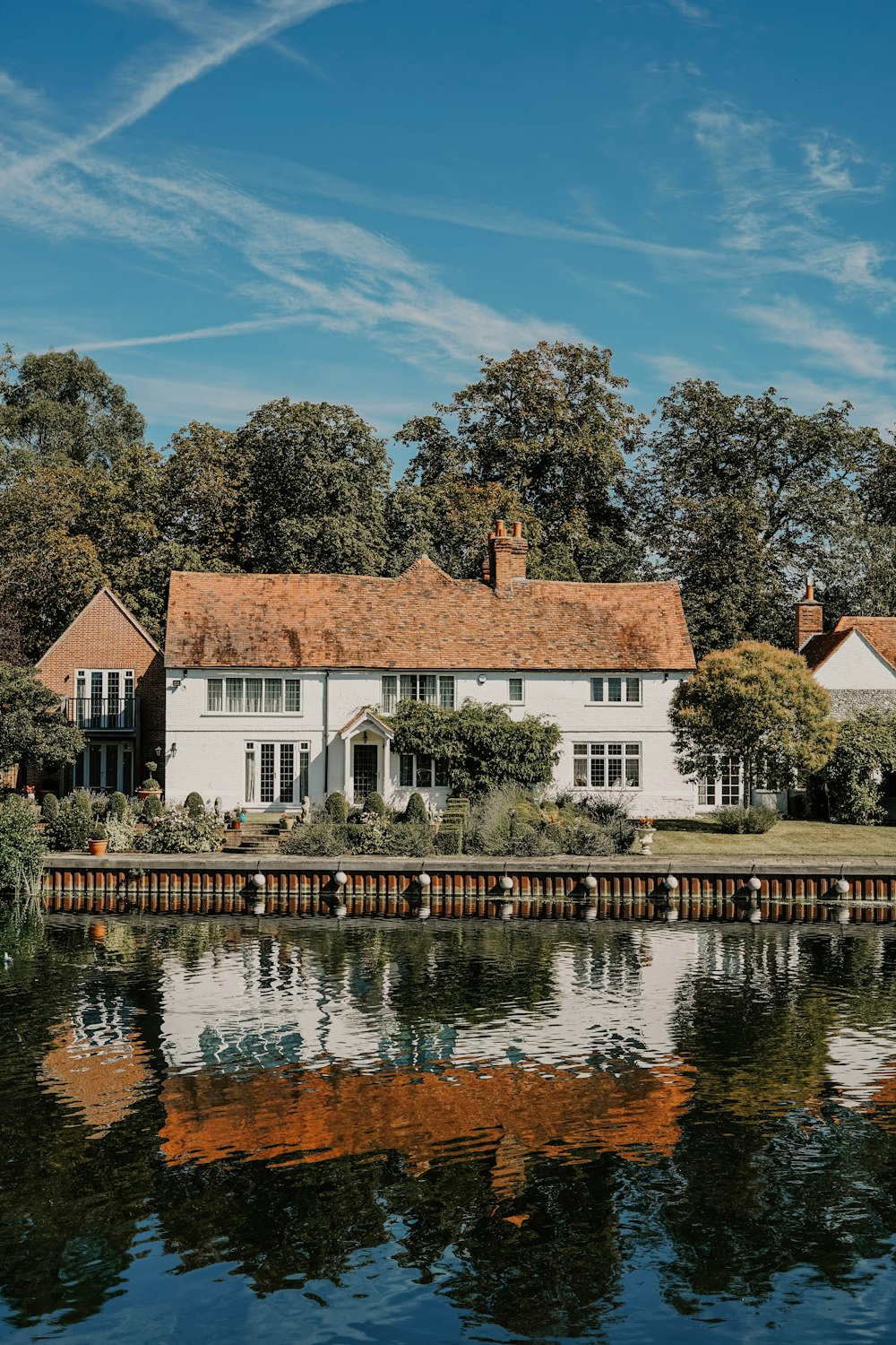 white 2-story house near body of water