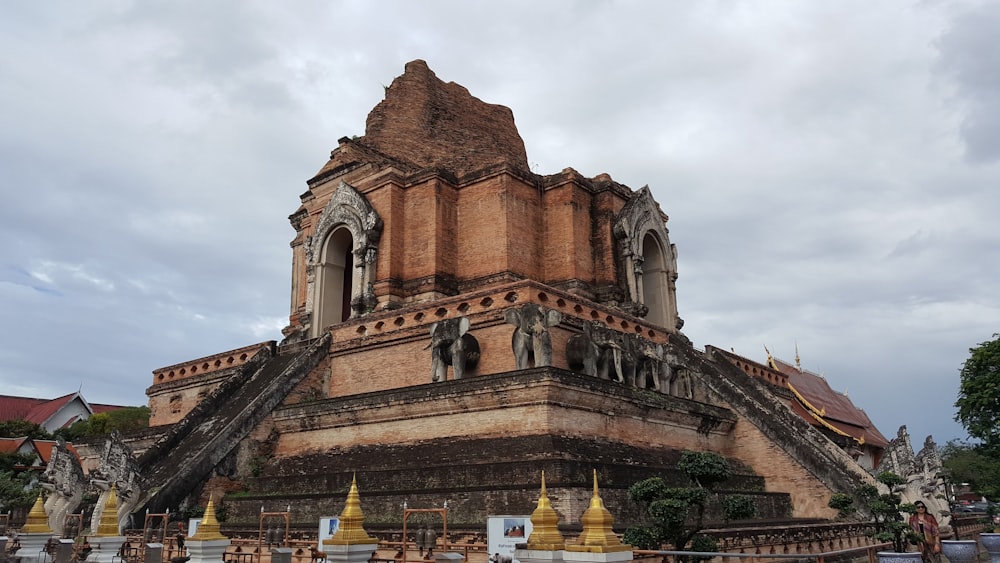 a large building with a statue on top of it