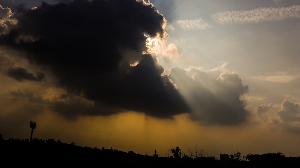 black clouds with sun rays