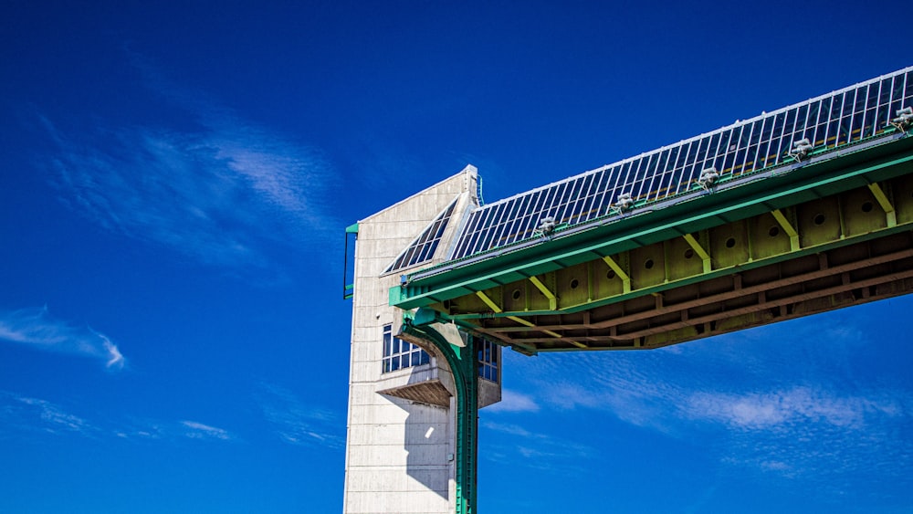 a tall white building under a blue sky