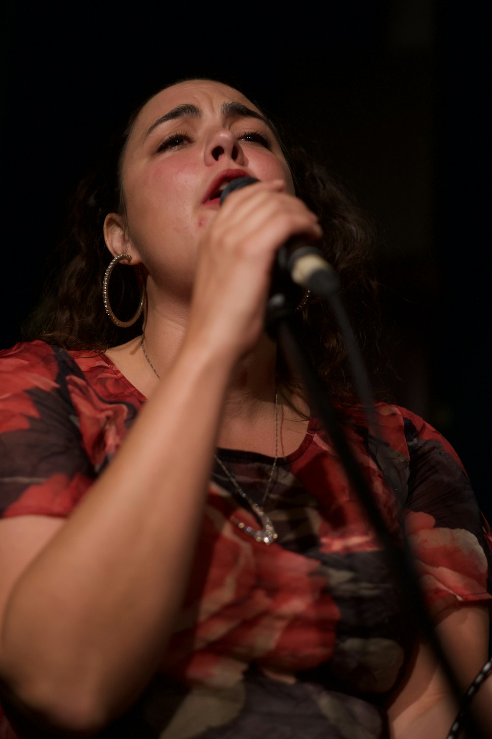 woman holding microphone