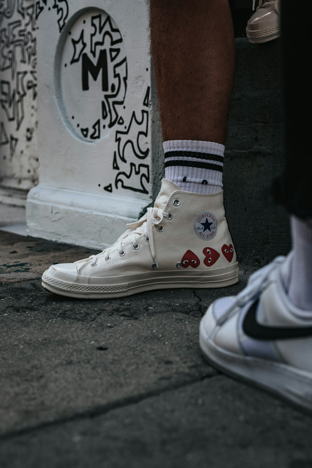 person wearing white sneakers