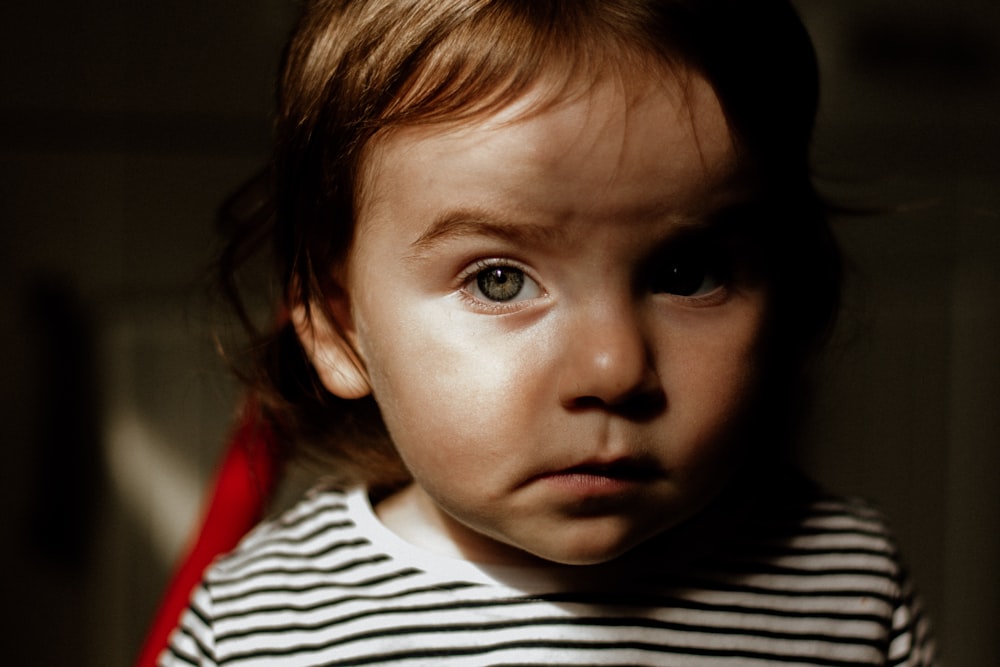 toddler wearing black and white stripe shirt