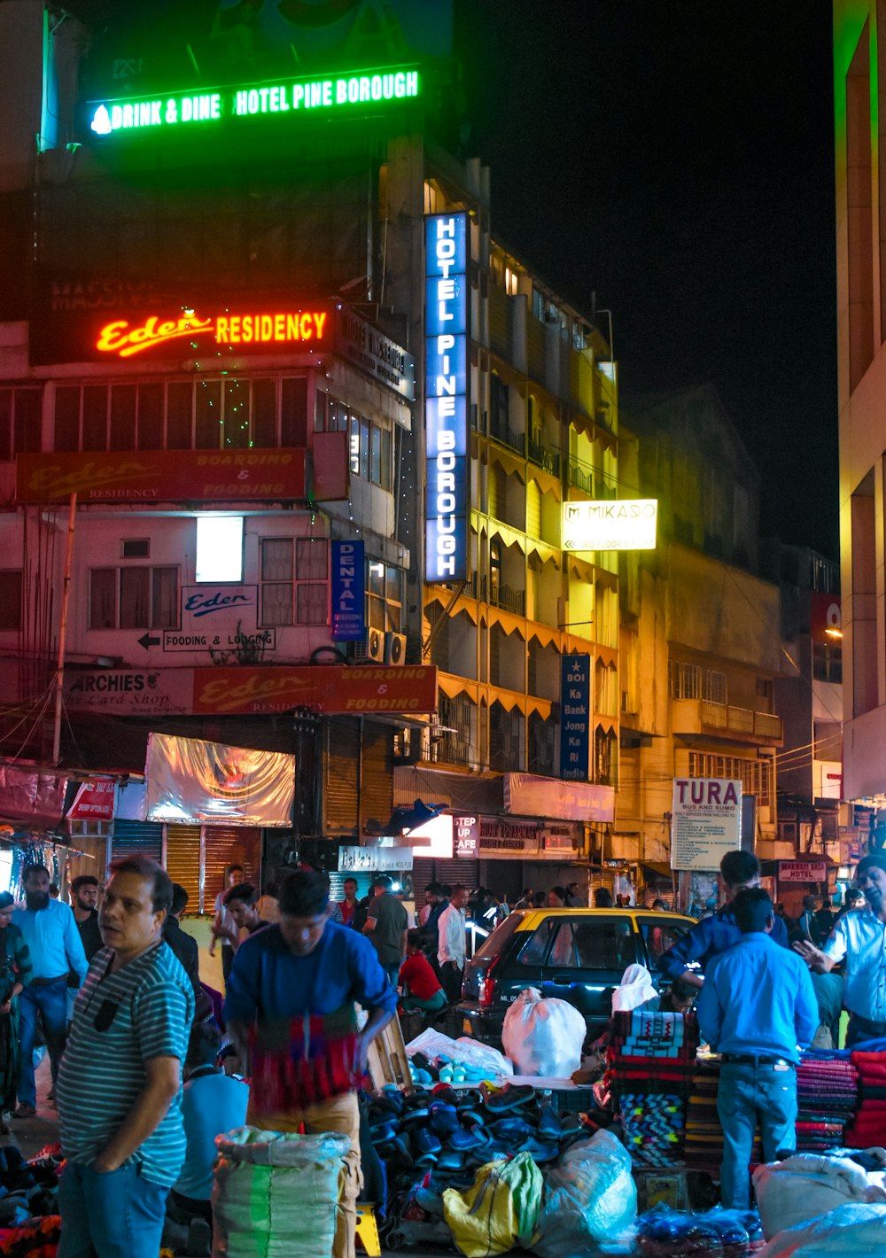 people standing on streets during nighttime