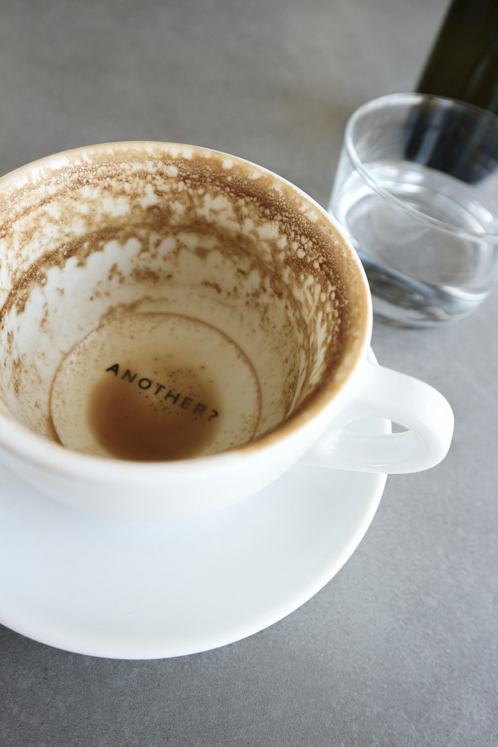 white ceramic coffee cup with saucer