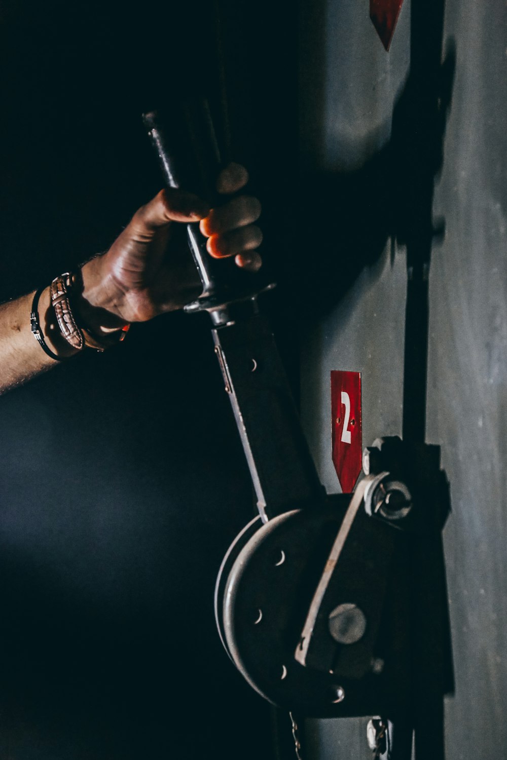 person holding black lever