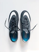 Athletic shoes lined up neatly, freshly ozone-treated and odor-free.