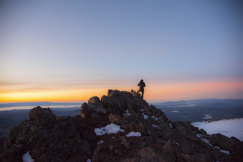 person standing on rocks