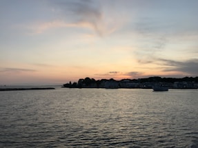 A serene view of the Huntsville waterfront at sunset, highlighting the peaceful setting of the upcoming property.