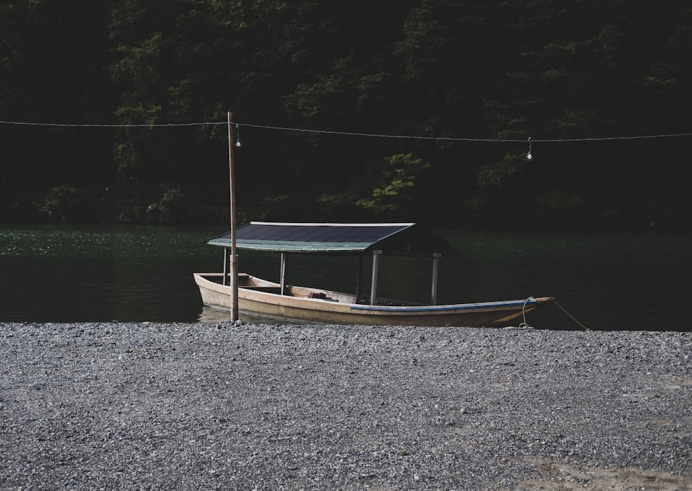 brown boat on lake