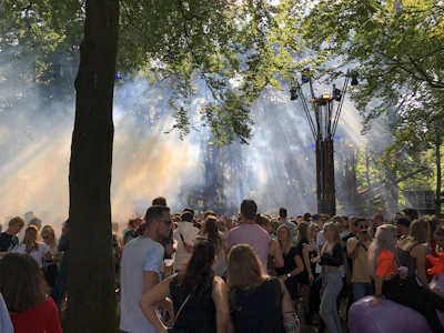 A peaceful outdoor gathering where people connect under soft sunlight.