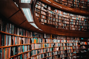 photo of brown wooden bookshelf