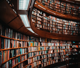 photo of brown wooden bookshelf