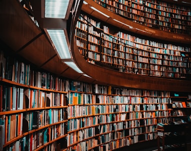 photo of brown wooden bookshelf