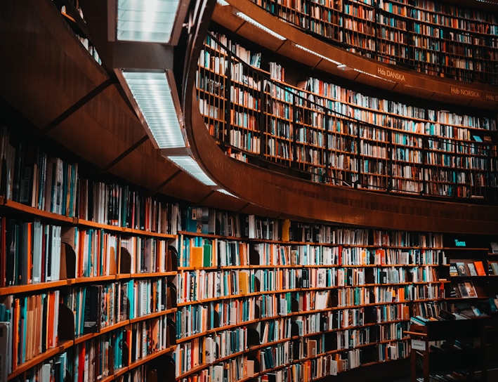 photo of brown wooden bookshelf