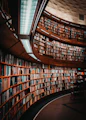 photo of brown wooden bookshelf
