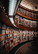 photo of brown wooden bookshelf