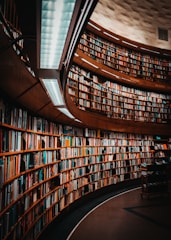 photo of brown wooden bookshelf