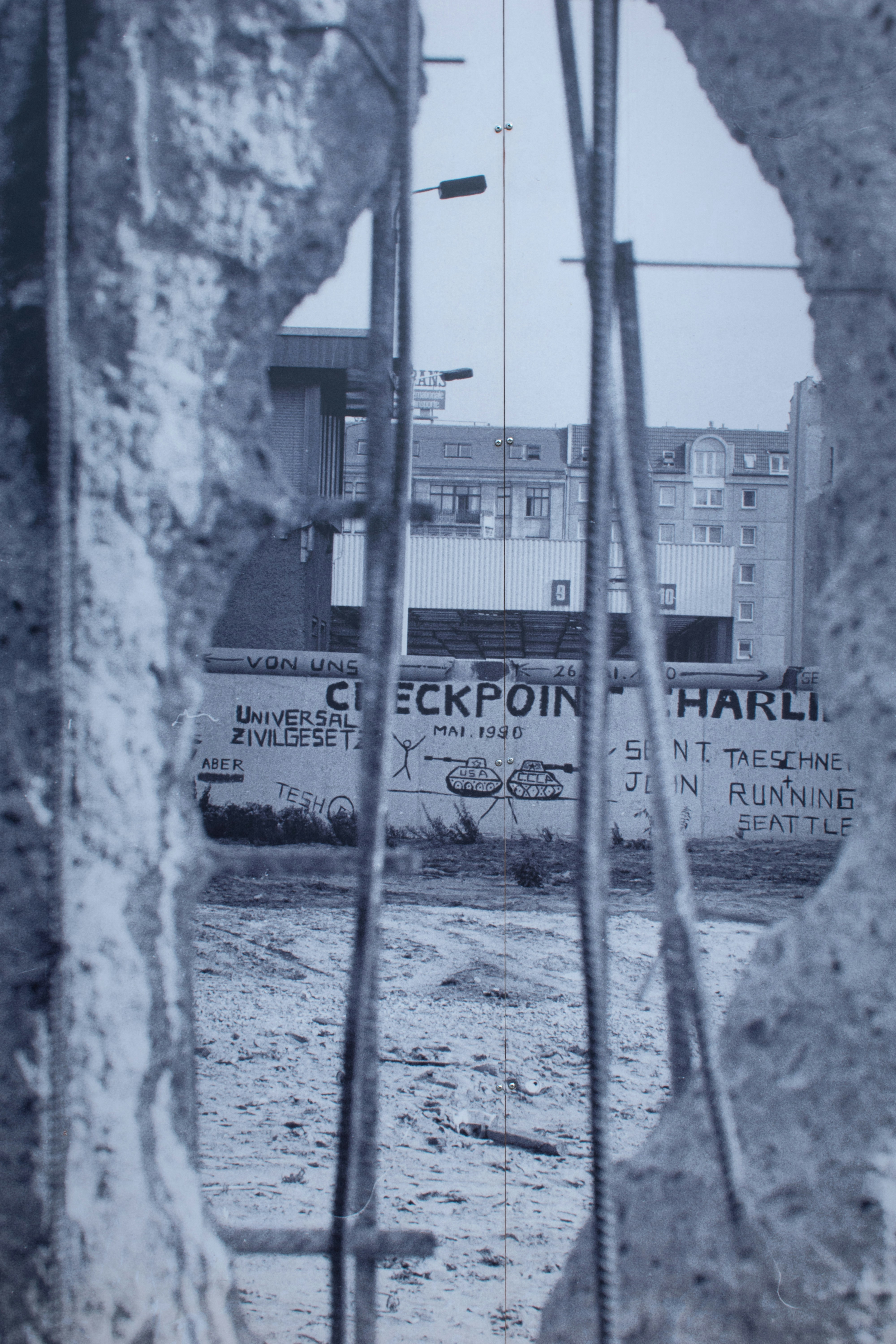 grayscale photography of building ruins with Checkpoint paint