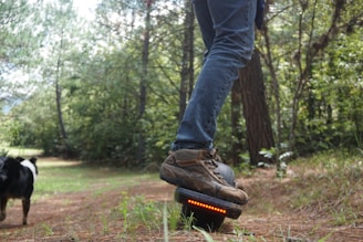 A runner wearing hoversole shoes on a trail.