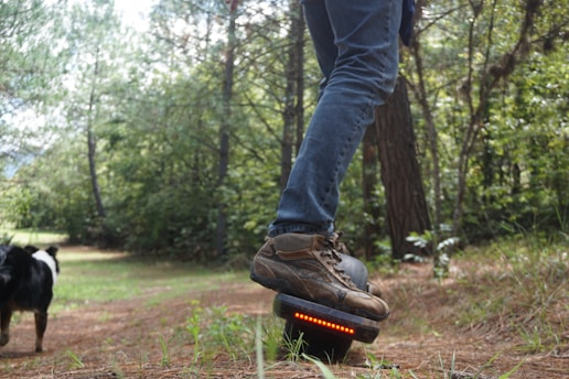 A runner wearing hoversole shoes on a trail.