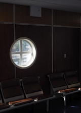 A peaceful waiting area with plush chairs and soft natural light.