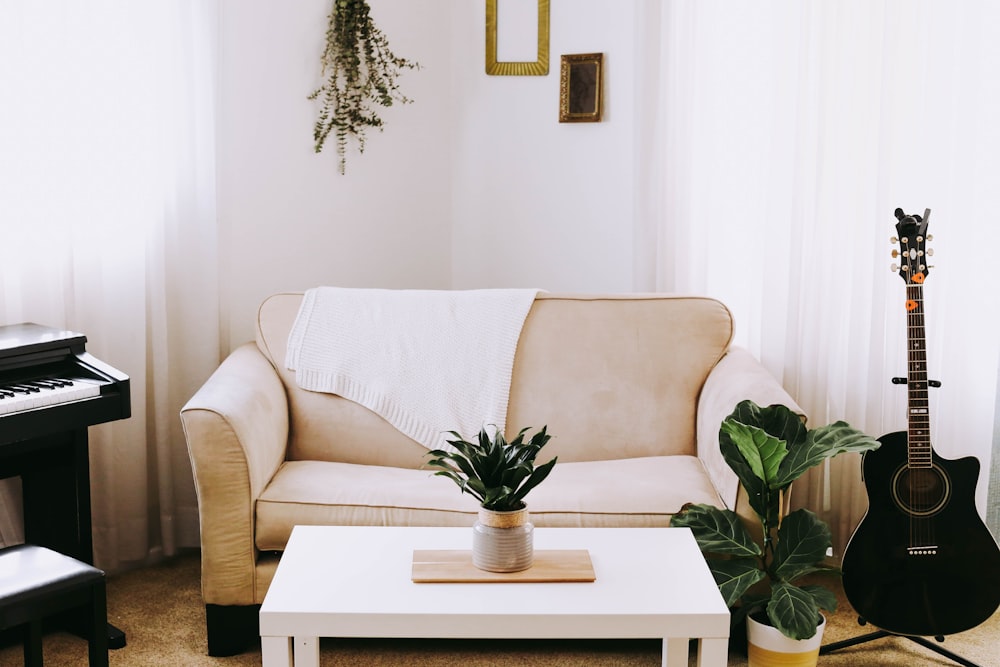 guitar beside sofa