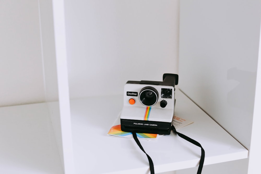 white and black instant camera