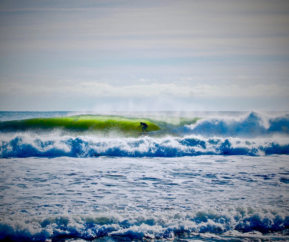 man surfing wave