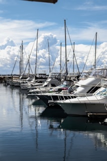 white boat in body of water during daytime
