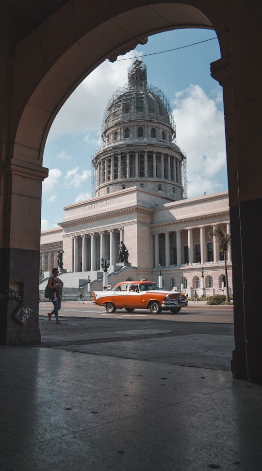 car on road near building in Havanna Cuba