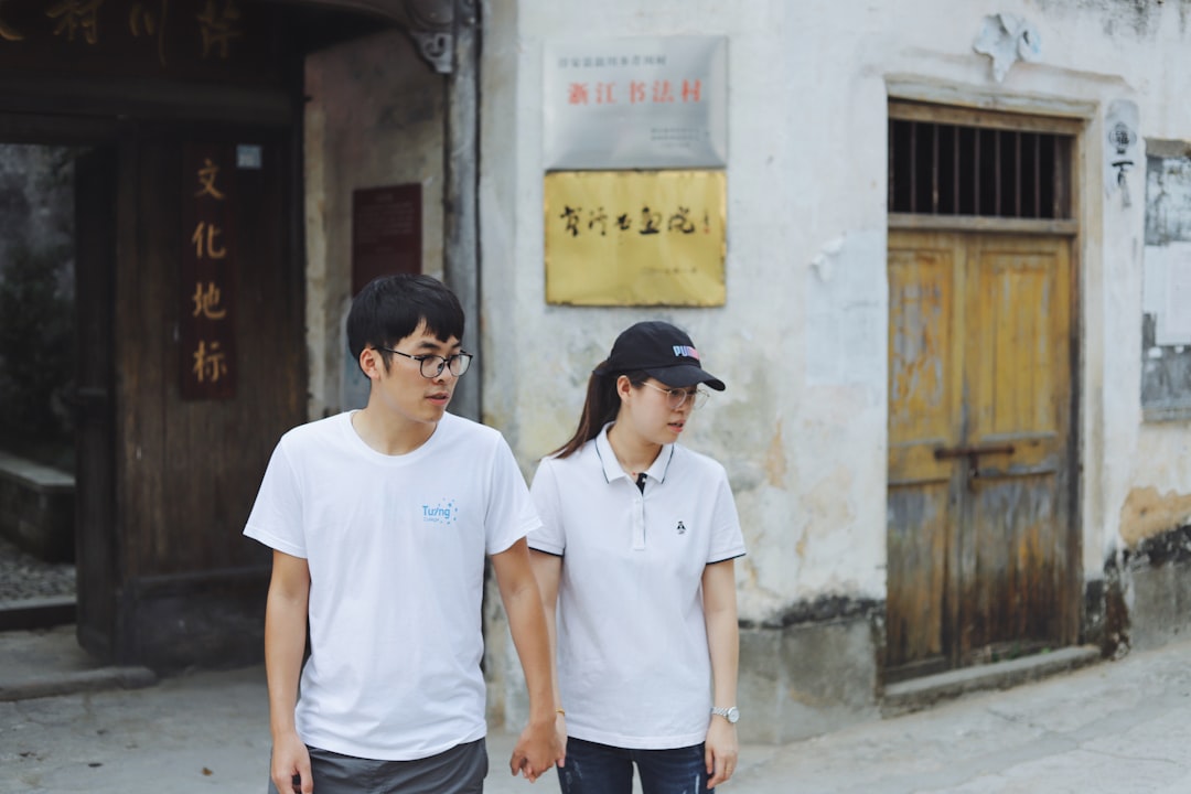 man and woman standing beside street