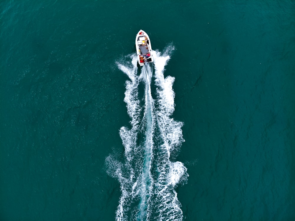 a boat traveling across a body of water