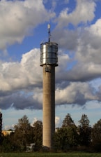 A sturdy mobile tower standing tall on a scenic landscape, ready for broadcasting and communication.