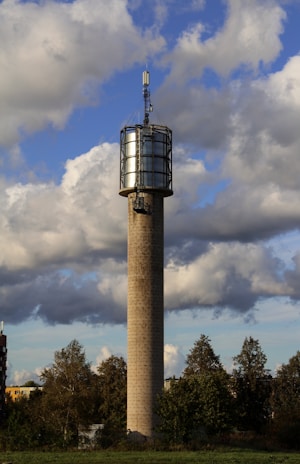 A sturdy mobile tower standing tall on a scenic landscape, ready for broadcasting and communication.