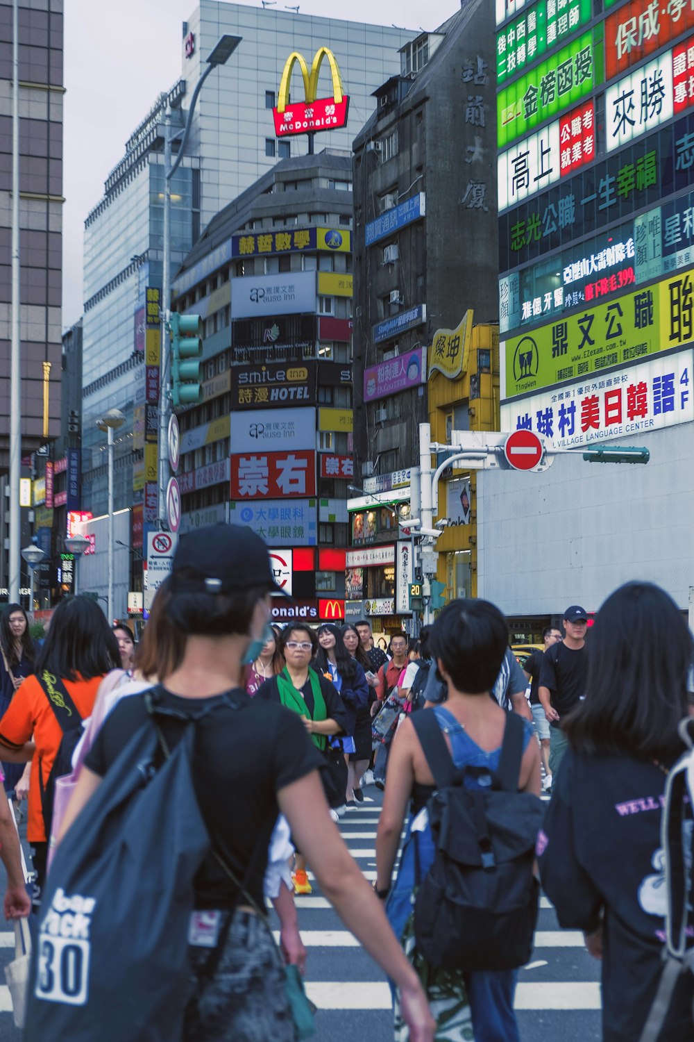 people walking on pedestrian lane during daytime