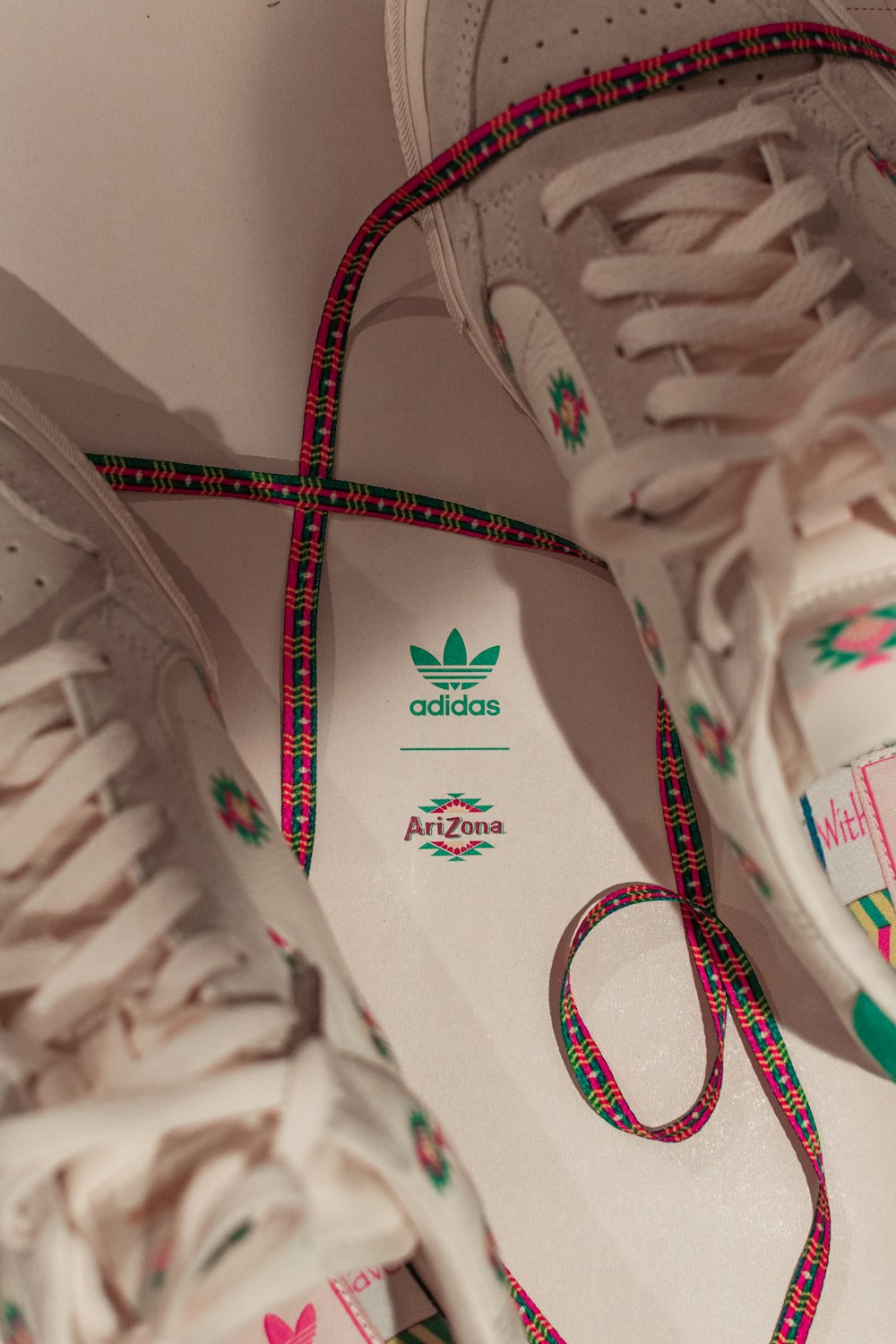 white-and-green adidas Arizona low-top sneakers